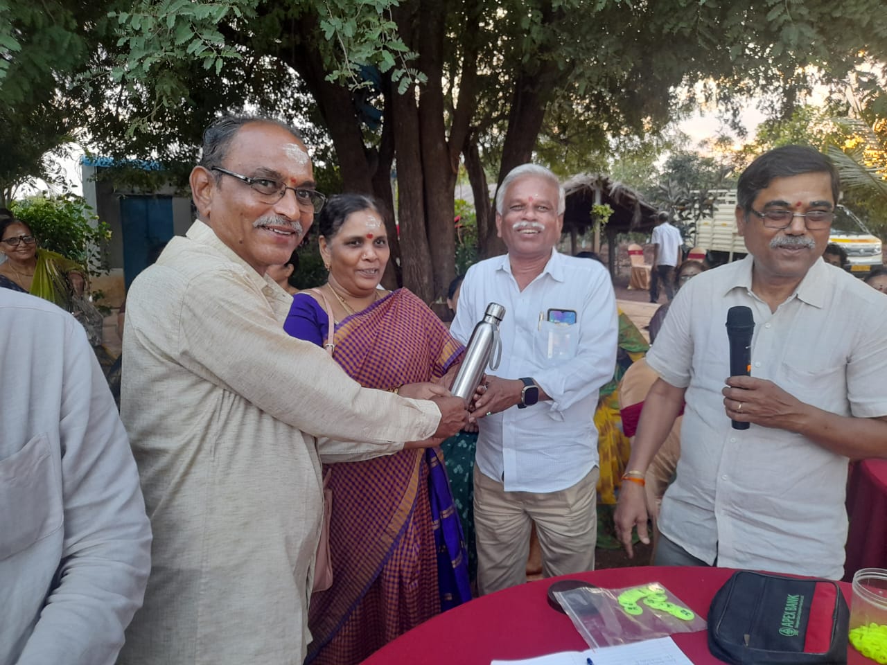 Smt. Lakshmi W/O V. Prabhakar receiving Second prize in Musical chair (Women) in get-together party held on 22-11-2023.